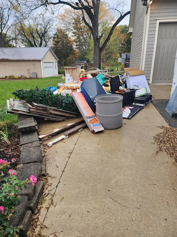 Dumpster being loaded with debris for 30 Yard Dumpster Rental in Centerville